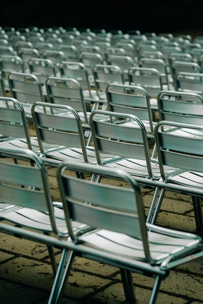 A row of empty chairs sitting next to each other